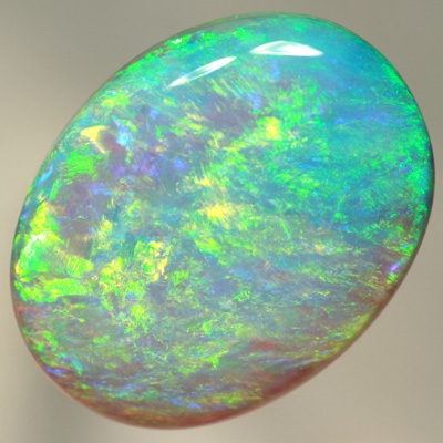 SOLID CRYSTAL OPAL Large opal. 11ct.  Bright green over purple. SEE VIDEO